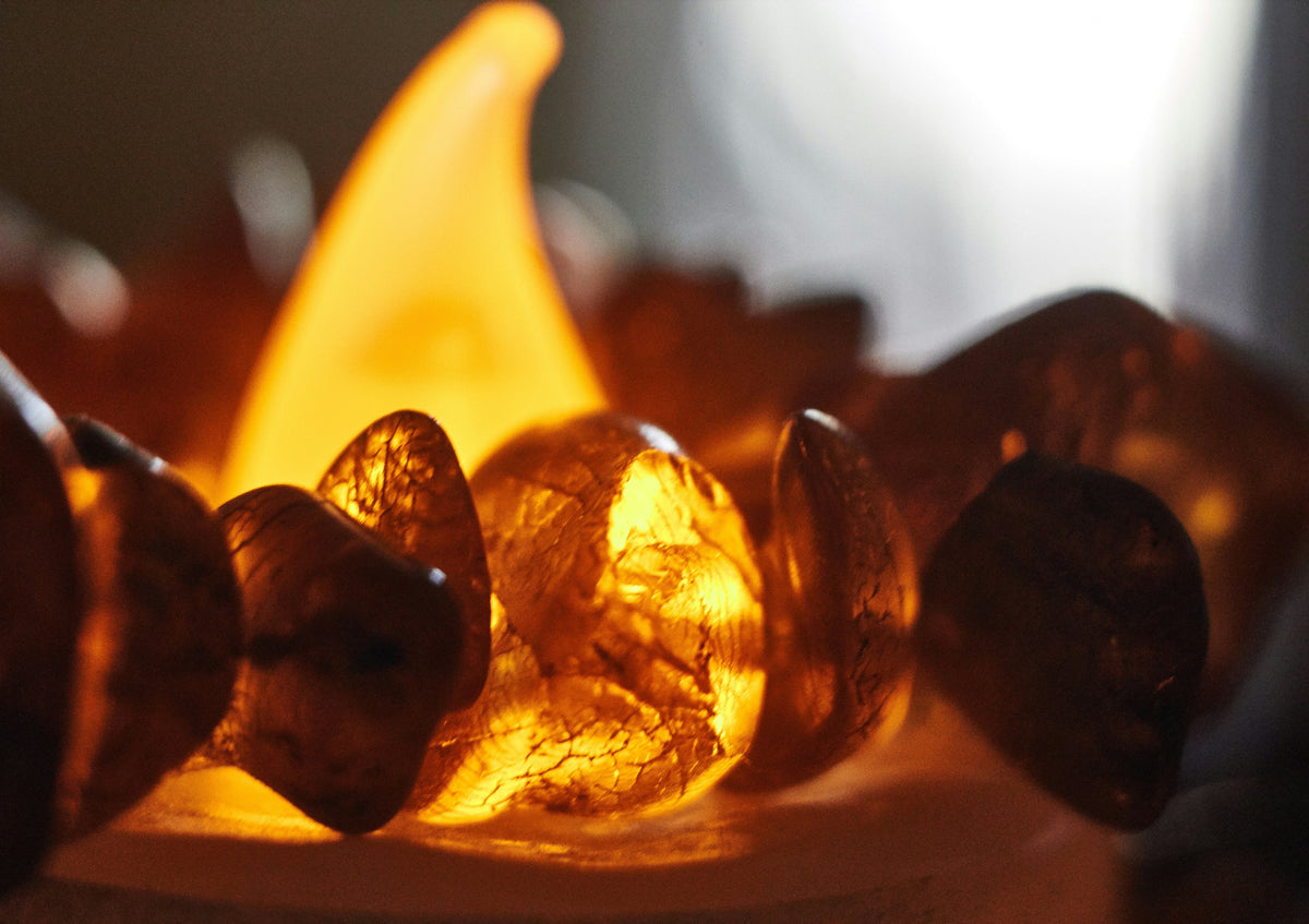 Raw fossilized amber resin, honey-gold and translucent