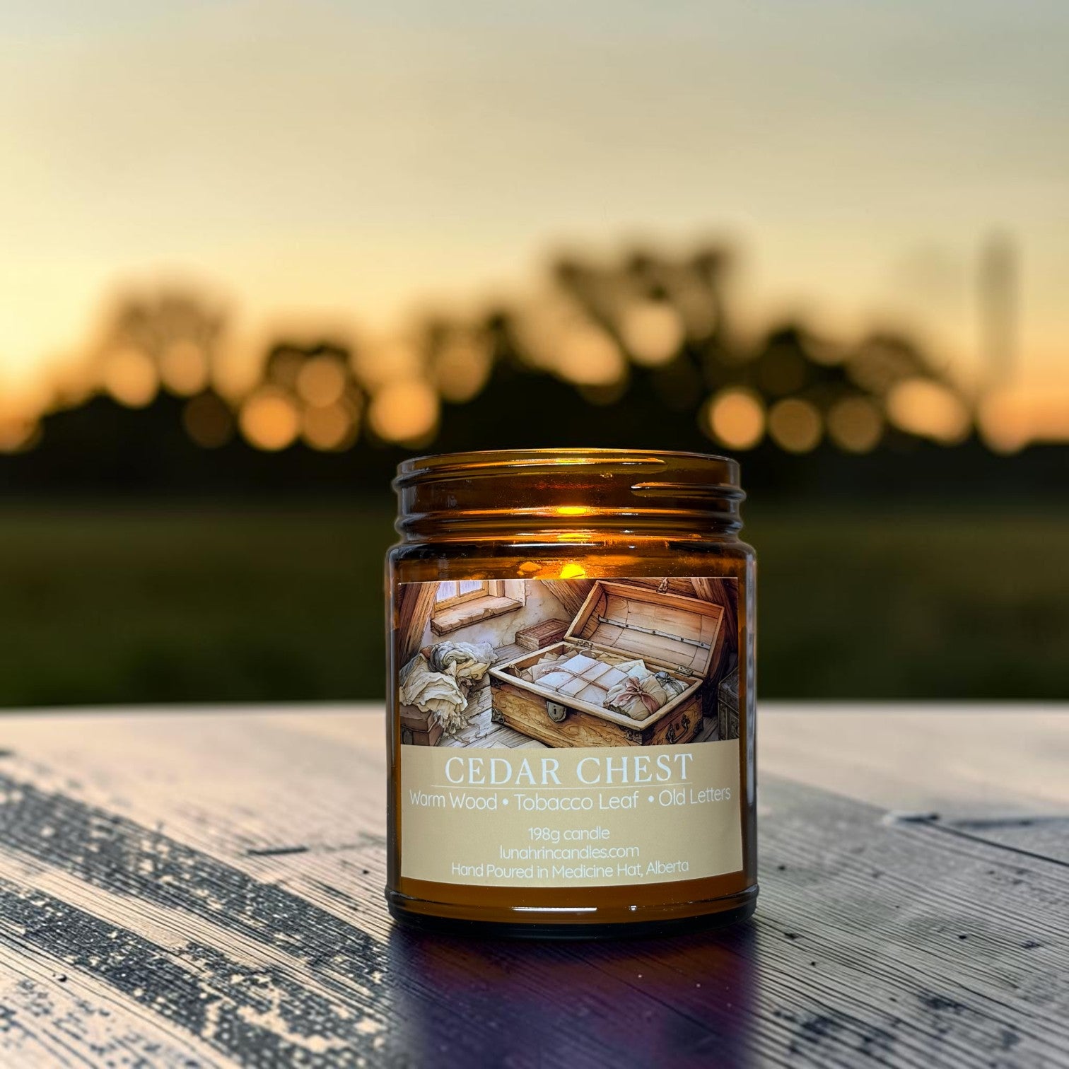Cedar Chest candle in amber glass jar, warm wood and tobacco leaf scent, hand poured in Medicine Hat, Alberta