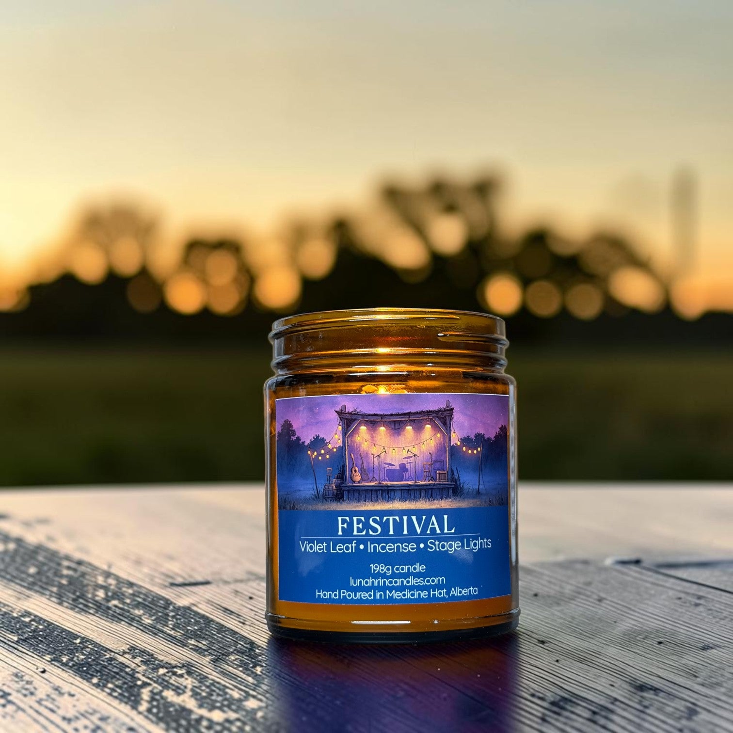 Festival candle in amber glass jar, incense and violet leaf scent, hand poured in Medicine Hat, Alberta