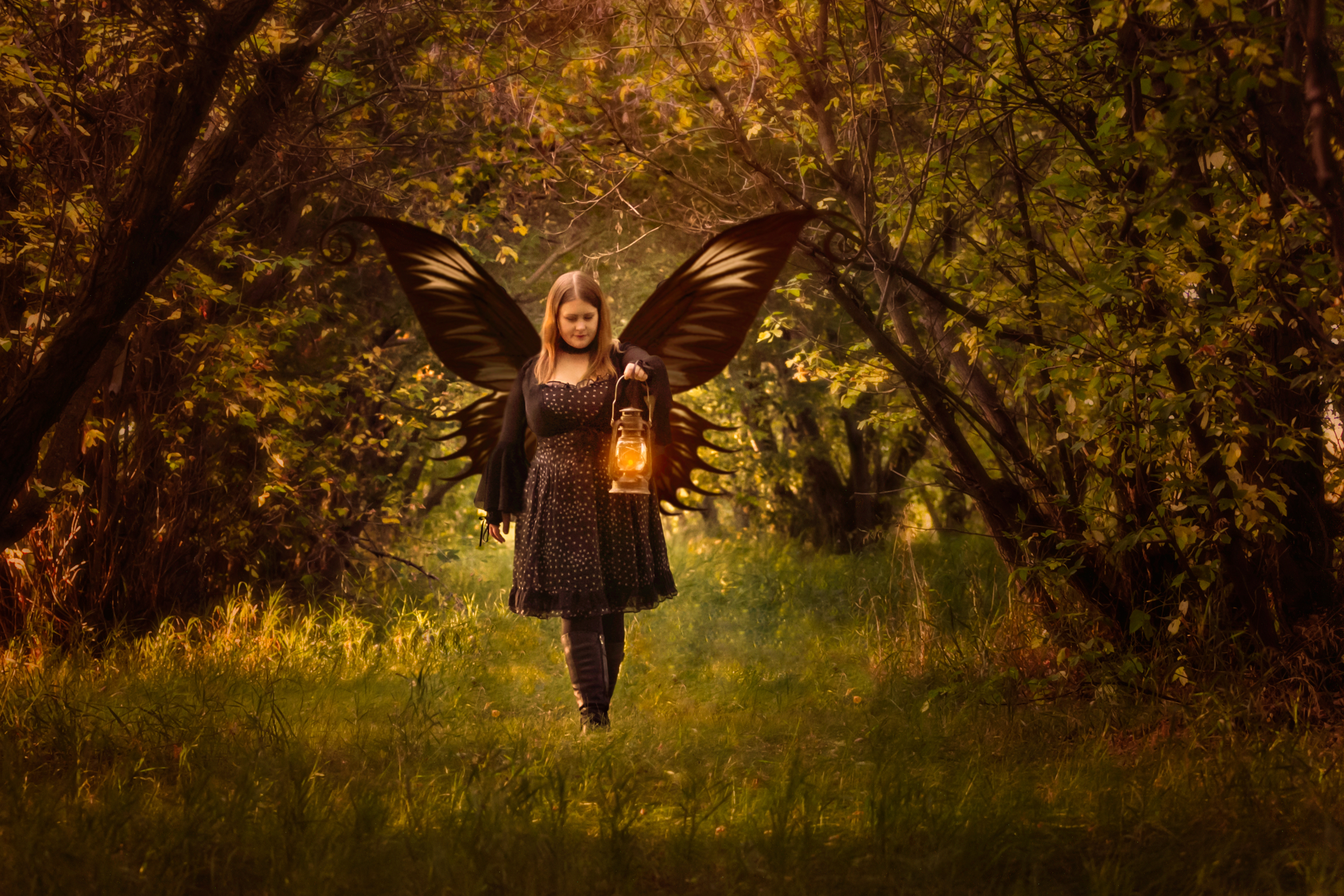 Jenn, maker of Lunahrin Candles, in a golden autumn orchard