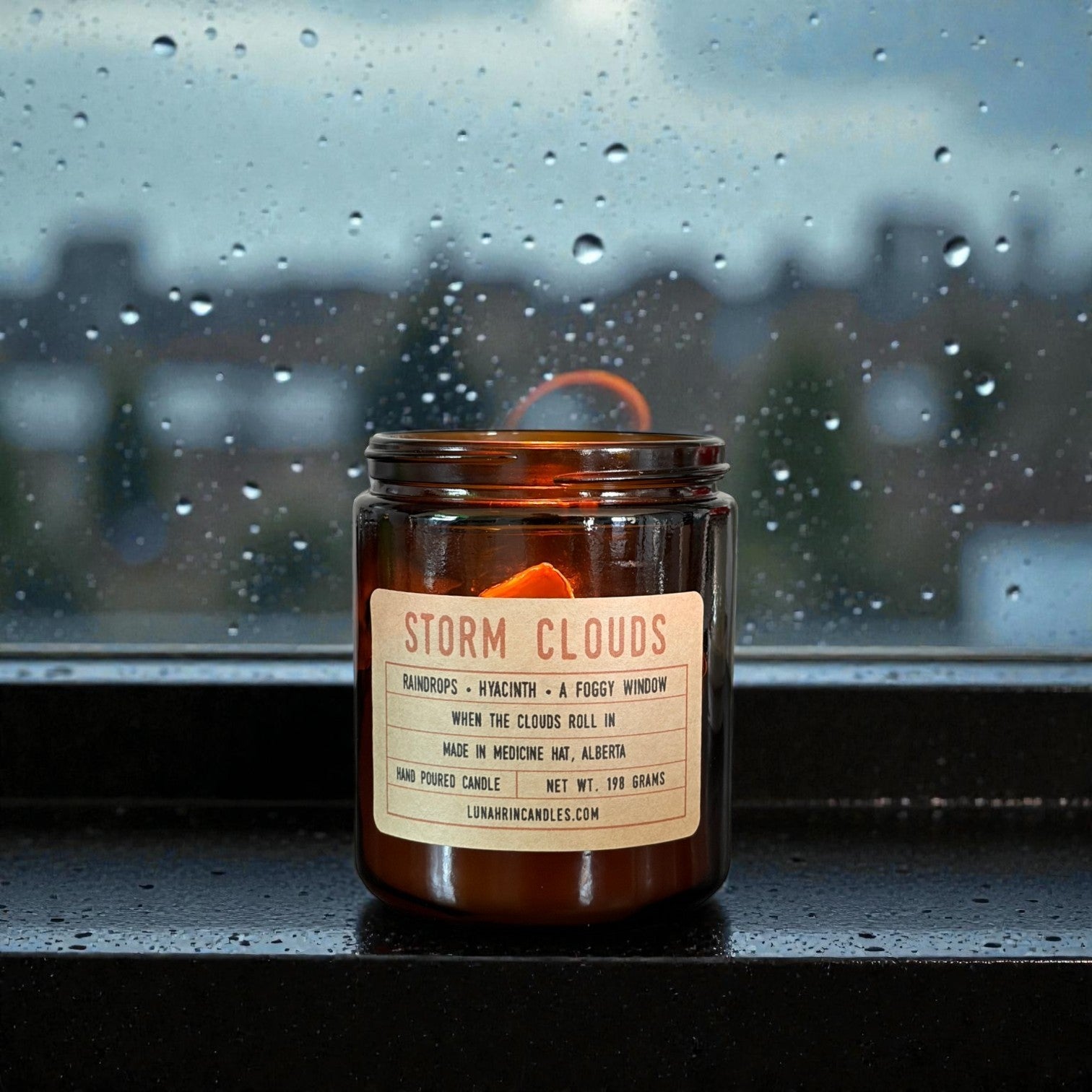 Storm Clouds candle in amber glass jar, hand poured in Medicine Hat, Alberta